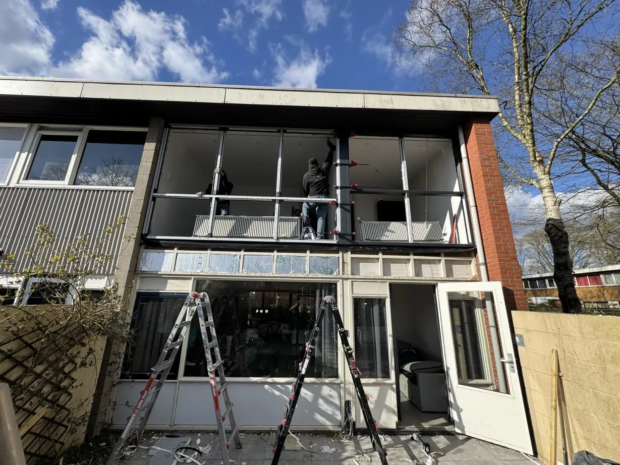 Choice installers replacing windows on the first floor of a home